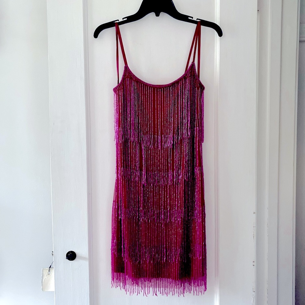 Adrianna Papell's beaded petite cocktail dress.
Hidden back zipper